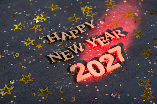 Happy new year 2027 with festive decorations and colorful stars