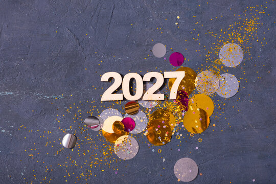 Celebration in 2027 with colorful confetti and bright decorations on a flat surface