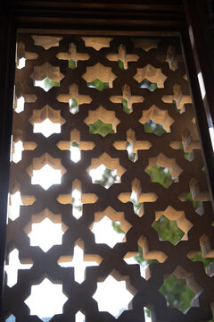 Traditional shebeke stone carved window screen lattice in Palace of Shirvanshahs Baku Azerbaijan with copy space