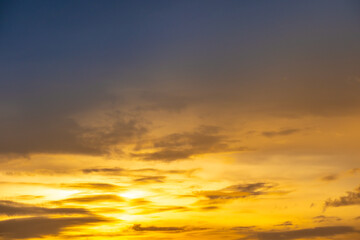 Fototapeta premium Enjoy panoramic views of the skyline . Sunset in the evening sky with colorful clouds and beautiful cloud patterns Amidst the soft golden light 