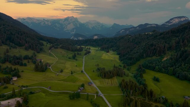 Dramatic sunset over the green alpine Heutal mountain valley near Lofer, Salzburger Land, Austria.