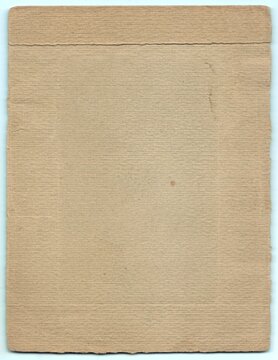 Blank, textured brown paper with visible fibers and slight creases, offering a rustic, vintage look. It provides a warm, earthy background ideal for creative projects