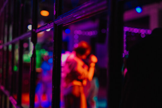 A wall illuminated by spotlights in a nightclub