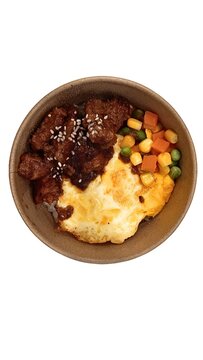 Top view of a delicious beef rice bowl served with fried egg and mixed vegetables in a paper bowl