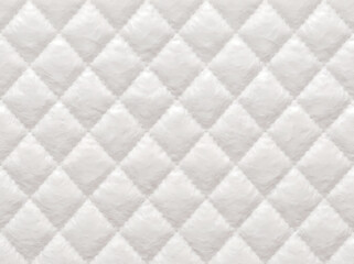 Obraz premium A close-up view of a pristine white quilted fabric with a diamond pattern, showcasing soft texture and even stitching.