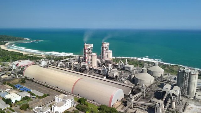 Aerial view of a coastal cement plant, symbolizing industrial strength, infrastructure growth and economic development.