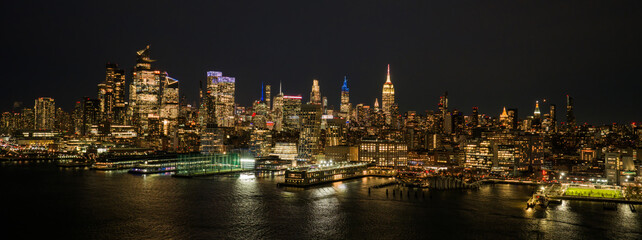 Fototapeta premium New York City panoramic skyline. NYC aerial skyline over downtown Manhattan. NewYork night skyline. New York skyline with Tower. NYC cityscape. New York waterfront. New York aerial view.