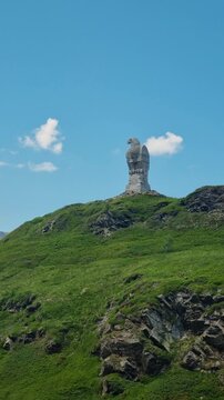 Vertical shot of the iconic Stone Eagle Monument on Simplon Pass, Switzerland, a WWII symbol of vigilance, showcasing the powerful eagle sculpture and its historic significance