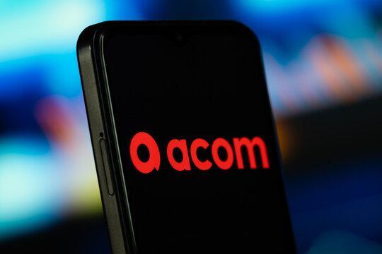 Manila, Philippines- 8 July 2026: acom logo is seen on a smartphone.