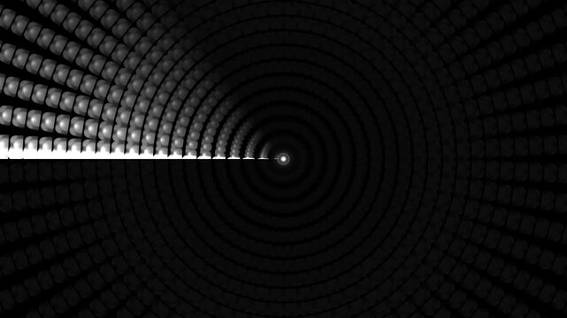 Light rays shine from one side and create a pattern of concentric circles in dark tones. The arrangement gives an impression of depth and motion in a simple design