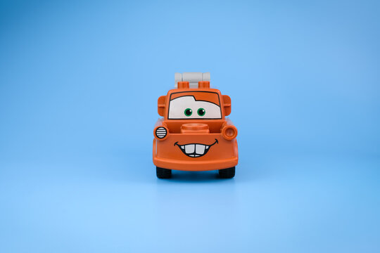 A front view of a Tow Mater character toy from Disney Pixar Cars shows its smiling face, brown body on a light blue background on Jul 25, 2026 in Jakarta, Indonesia