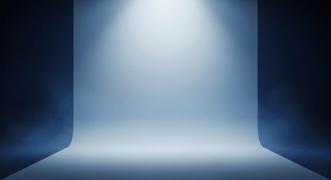 Minimalist Blue Studio Backdrop with Top Spotlight and Subtle Fog for Professional Product Photography