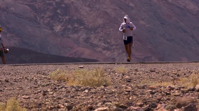 Athlete hiding from the sun in death valley marathon
