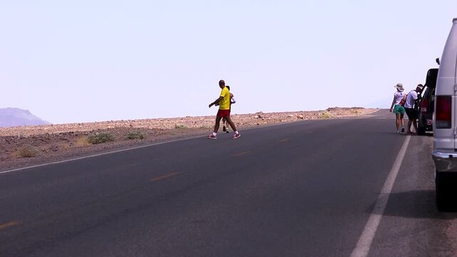 athlete running off in to the desert