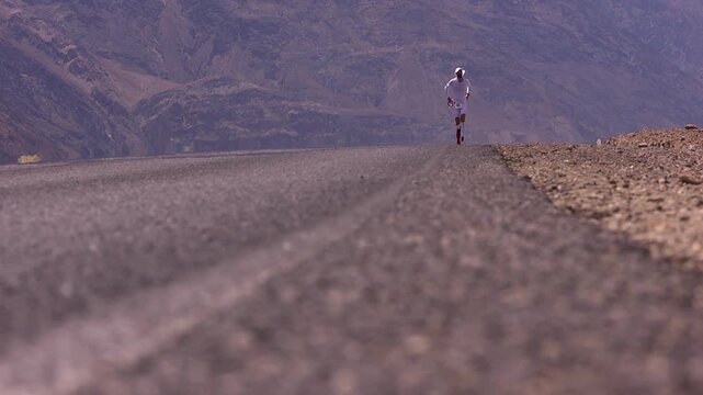 Badwater athlete running on the hot asphalt