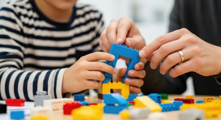 Fototapeta premium Parent and child playing with plastic bricks. Family building colorful toy blocks together.