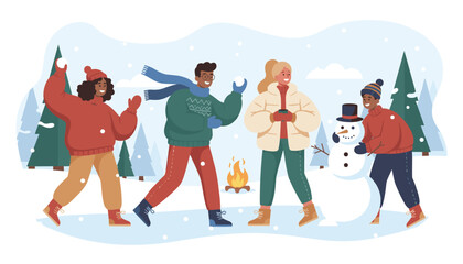Fototapeta premium Group of diverse friends enjoys a snowy winter day outdoors while playing in the snow and building a snowman near a warm campfire.