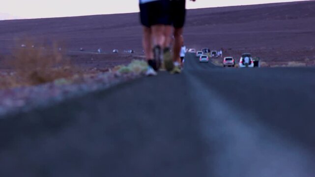 Close up of athletes feet running in death valley