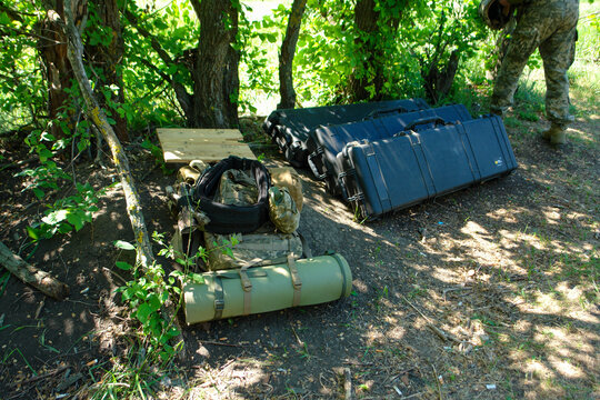 Peli Hard Cases and Tactical Backpack Equipment Setup in Field Camp