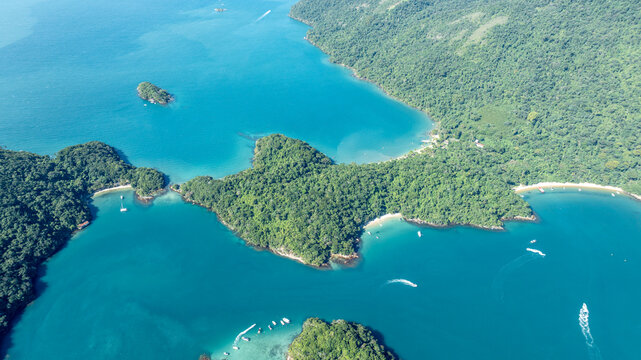 Aerial view of Lagoa Azul with turquoise waters, lush green islands, and boats in Angra dos Reis, Rio de Janeiro, Brazil.