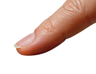 Fototapeta premium Close up of a human thumb showing clean fingernail against a solid black background