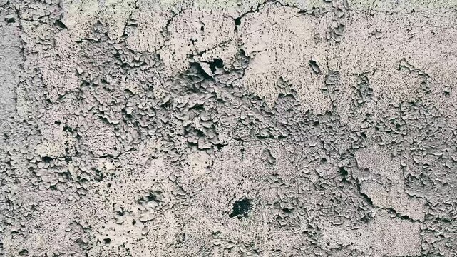 Dynamic, dirty wall texture with scratches and scuffs. 4K video