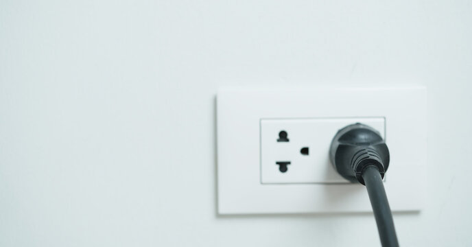 Electrical plugs with circuit breakers and fire-resistant materials for safety