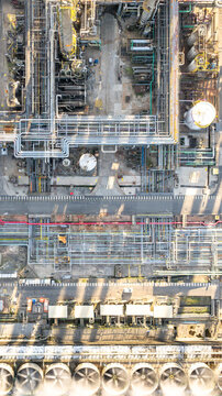 Aerial view of a petrochemical complex with complex pipe networks, storage tanks, and industrial cooling fans in Santo Andre, State of Sao Paulo, Brazil.