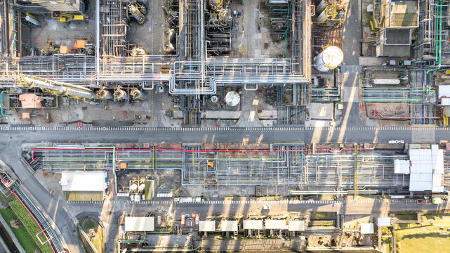 Aerial view of the Capuava Petrochemical Complex featuring intricate networks of industrial pipes, storage tanks, and processing units in Santo Andre, State of Sao Paulo, Brazil.