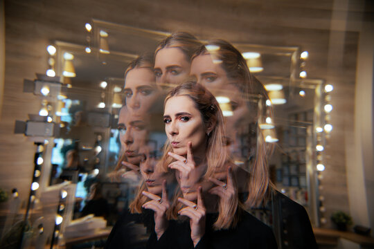 Creative Portrait of a Suspicious Young Woman Thinking. Thoughtful female model looking skeptically while her face multiplies