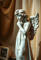 Fototapeta premium White angel statue with wings and thoughtful expression, spiritual and religious art, hope and guidance