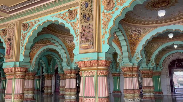 Ornately decorated pillars and arches inside Mysore Palace in Mysuru, Karnataka, India, showcasing the grandeur of Indo-Saracenic architecture and royal heritage