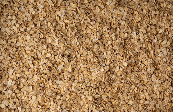 Oat flakes textured pattern, rolled oatmeal macro background