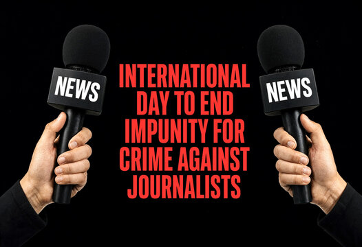 Two hands holding microphones with news labels for international day to end impunity campaign