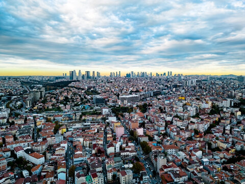 Sprawling cityscape under a dramatic cloudy sky
