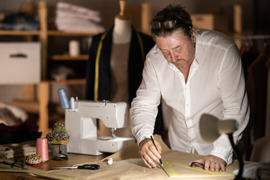 Male tailor draw create sketch of dress