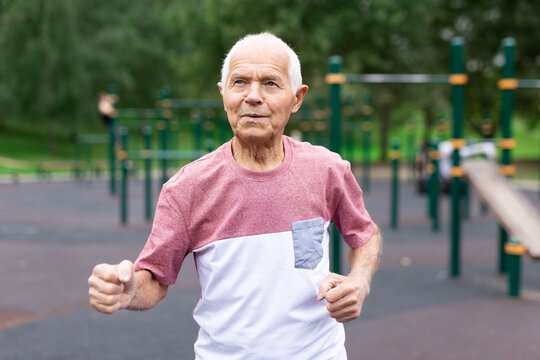 Elderly man running outdoors