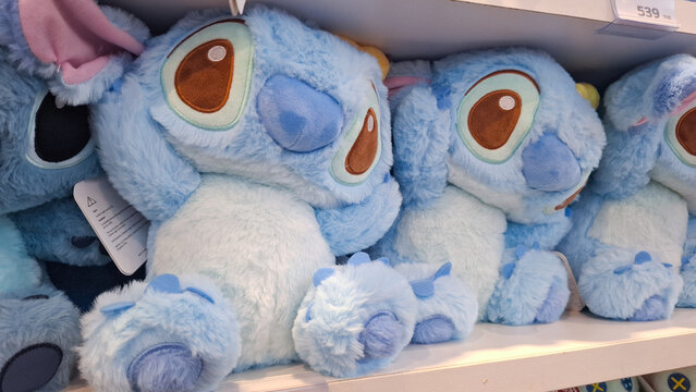 Disney Stitch character soft plush stuffed dolls lined up on retail store shelf display on May 1, 2026 in Bangkok, Thailand 