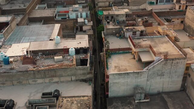 Bird's Eye Aerial Perspective of Rooftops and Narrow Street in a Dense Urban Neighborhood