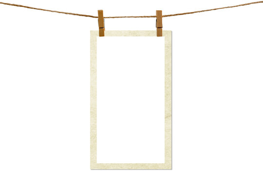 Blank photo frame hanging on a rope with a wooden clothespin. Isolated transparent PNG mockup.