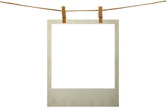Blank photo frame hanging on a rope with a wooden clothespin. Isolated transparent PNG mockup.