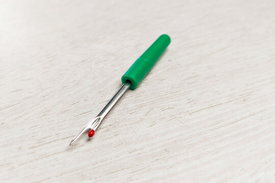 A sewing tool thread handler to open wrong stitches