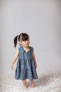 Cute Asian little girl playing indoors