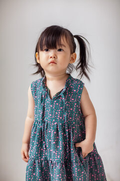Cute Asian little girl playing indoors