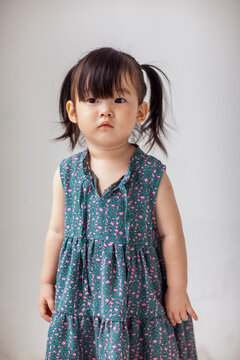 Cute Asian little girl playing indoors