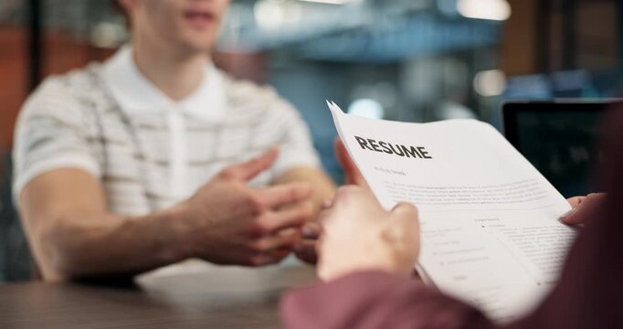 Interview, recruitment and hands in office with resume, portfolio or meeting in onboarding process. Contract, people or hiring in agency with document, candidate or proposal for career opportunity