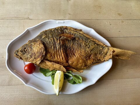Baked carp on a plate, Franconian speciality, Nuremberg, Franconia, Bavaria, Germany
