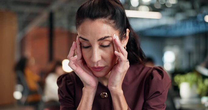 Tired, business and woman in office with headache, work stress or burnout for financial loss. Fatigue, mature person or coworking in workplace with migraine, dizziness and brain fog for finance error