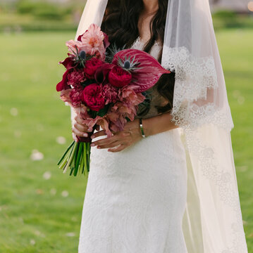 Bride Holding Crimson Pink Floral Bouquet Close-Up