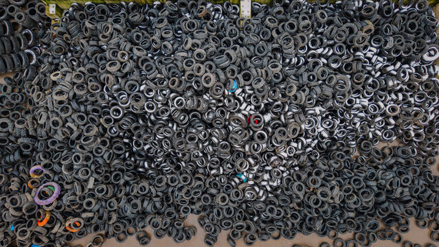 Aerial view of a massive pile of used car tires at a recycling facility in Valmiera, Valmiera, Latvija.